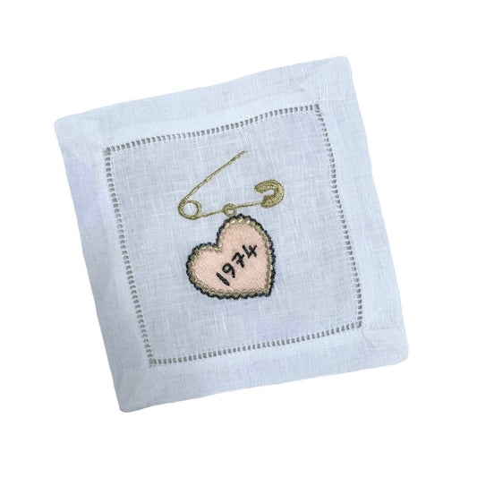 Heart charm embroidered artwork on white background