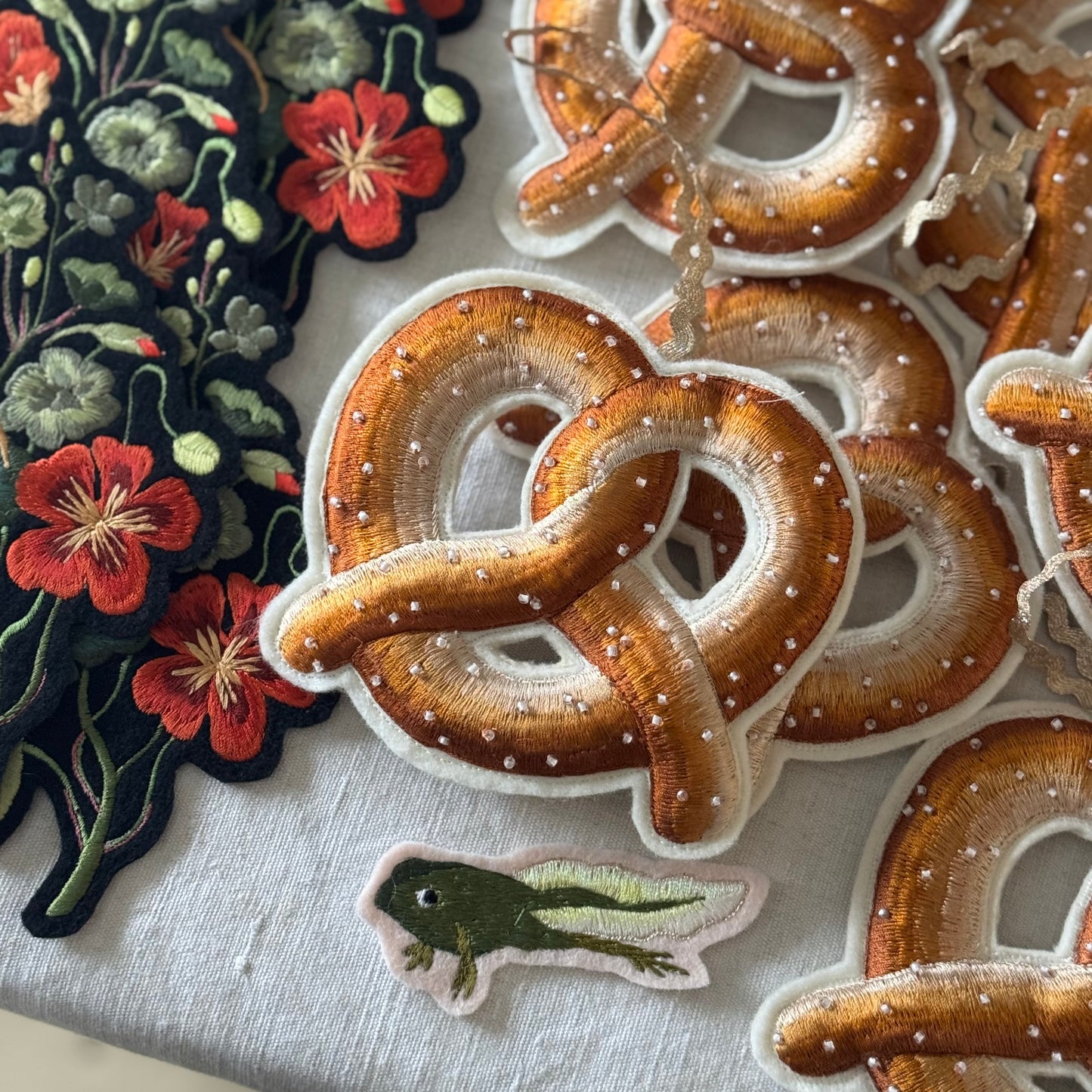 Selection of pretzel hanging decorations with nasturtium patches and tiny froglet patch