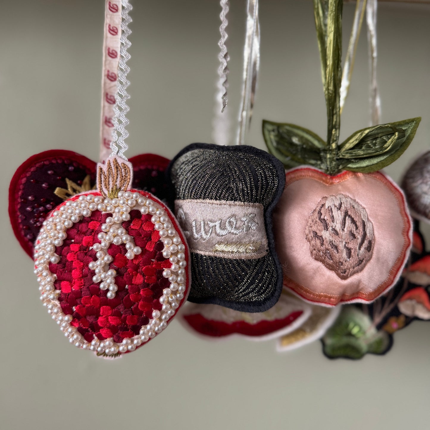 Decorative hanging christmas decorations with intricate designs hanging.