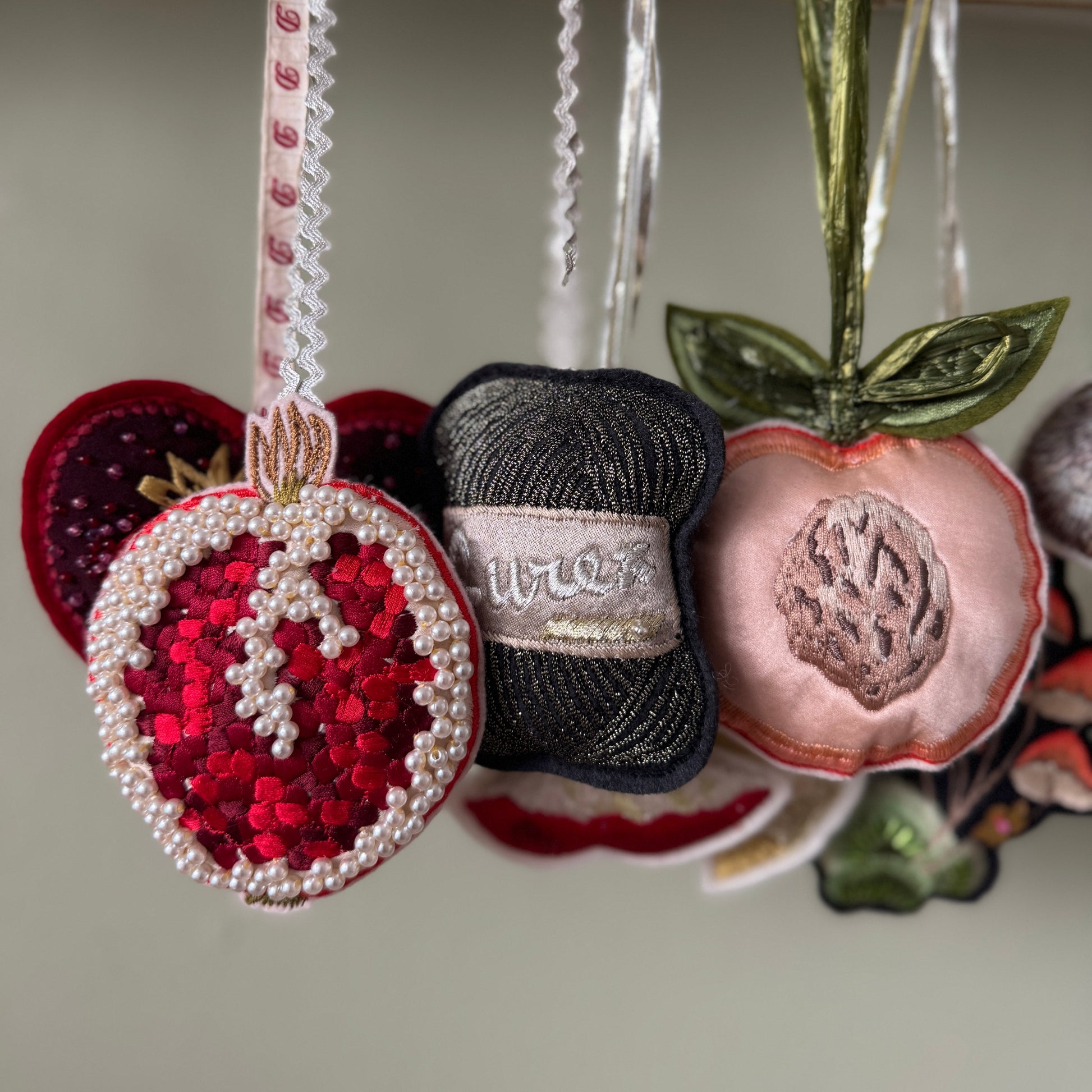 Decorative hanging christmas decorations with intricate designs hanging.