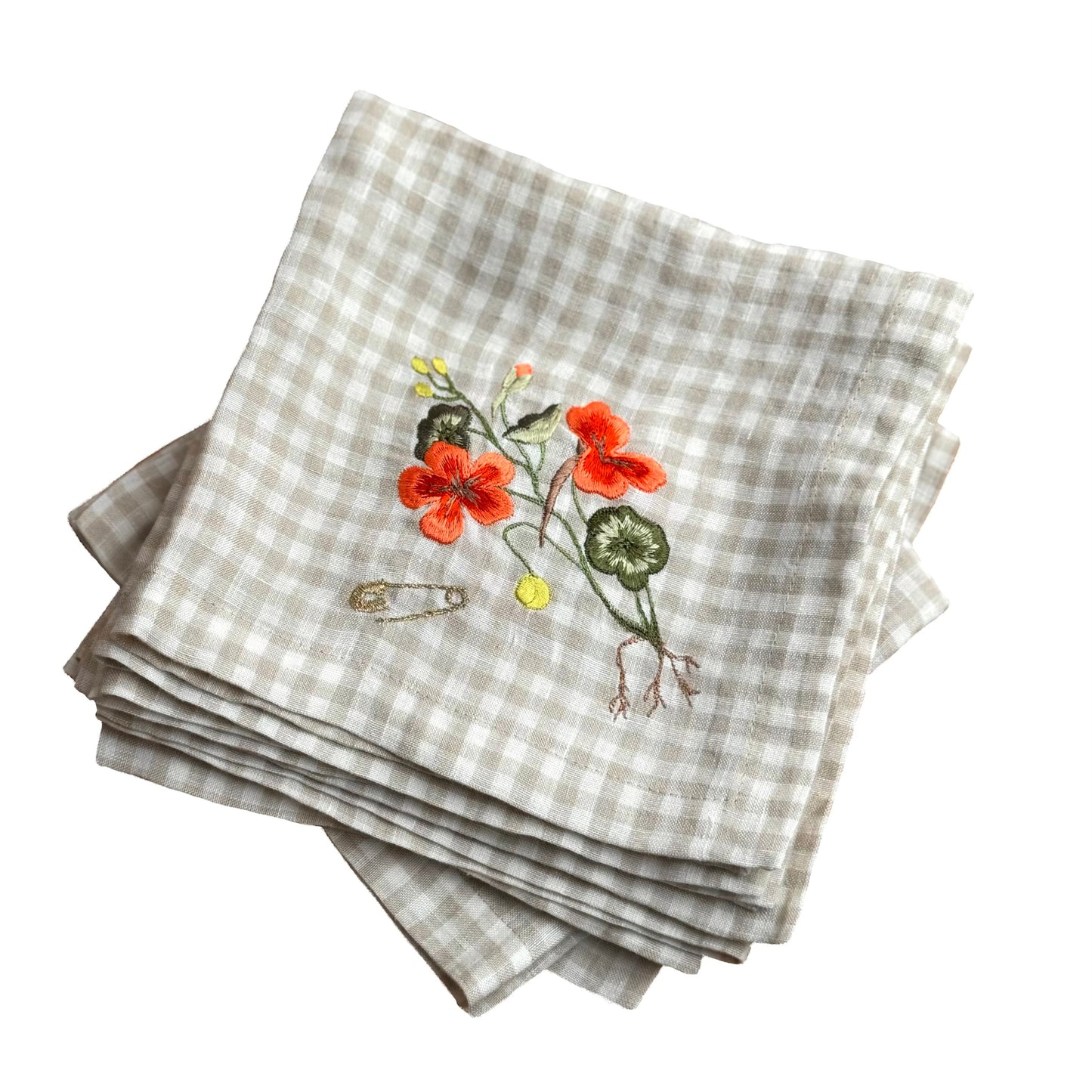 Stack of embroidered linen napkins with the nasturtium napkin featured on top
