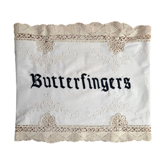 Butterfingers embroidered artwork on white background