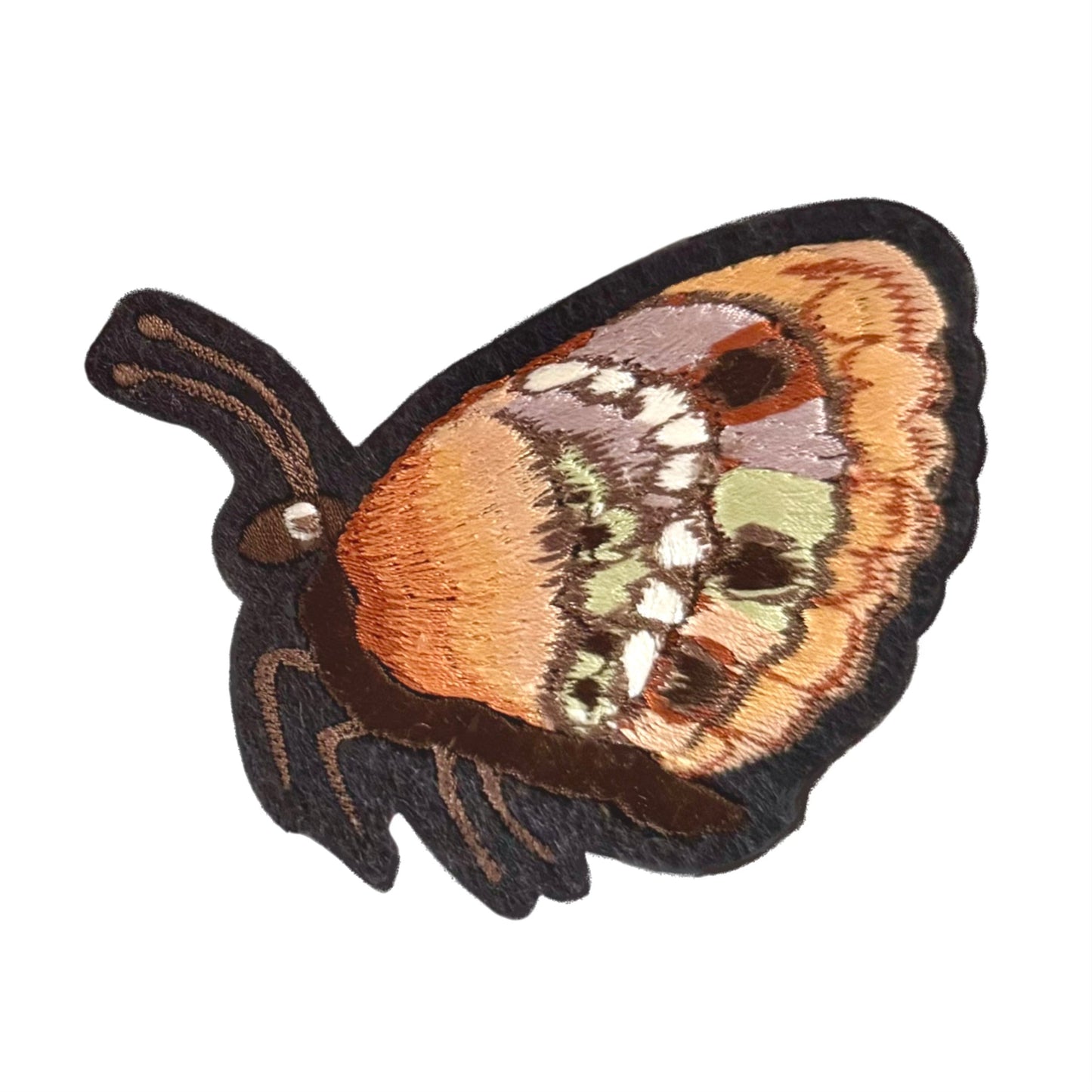 right embroidered butterfly patch on white backround