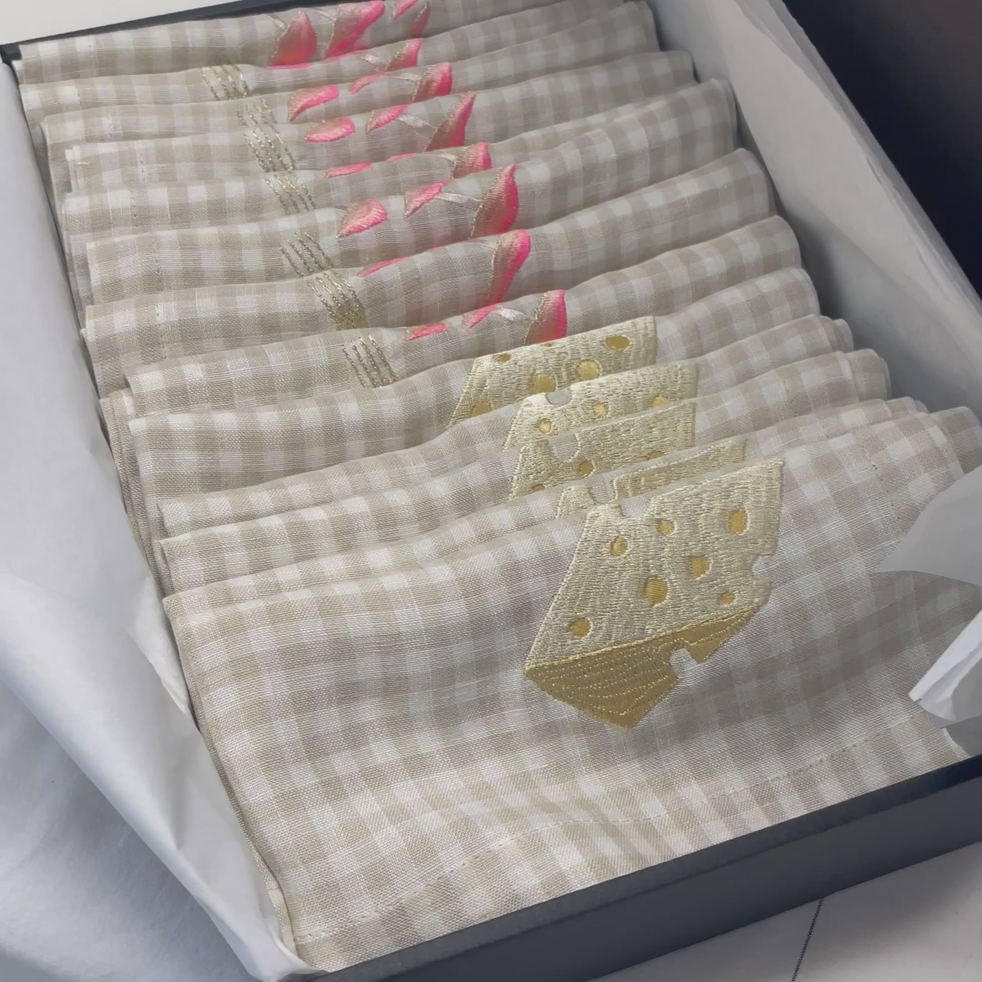 Box of pink mushroom and silk cheese embroidered gingham napkins packaged and ready to post