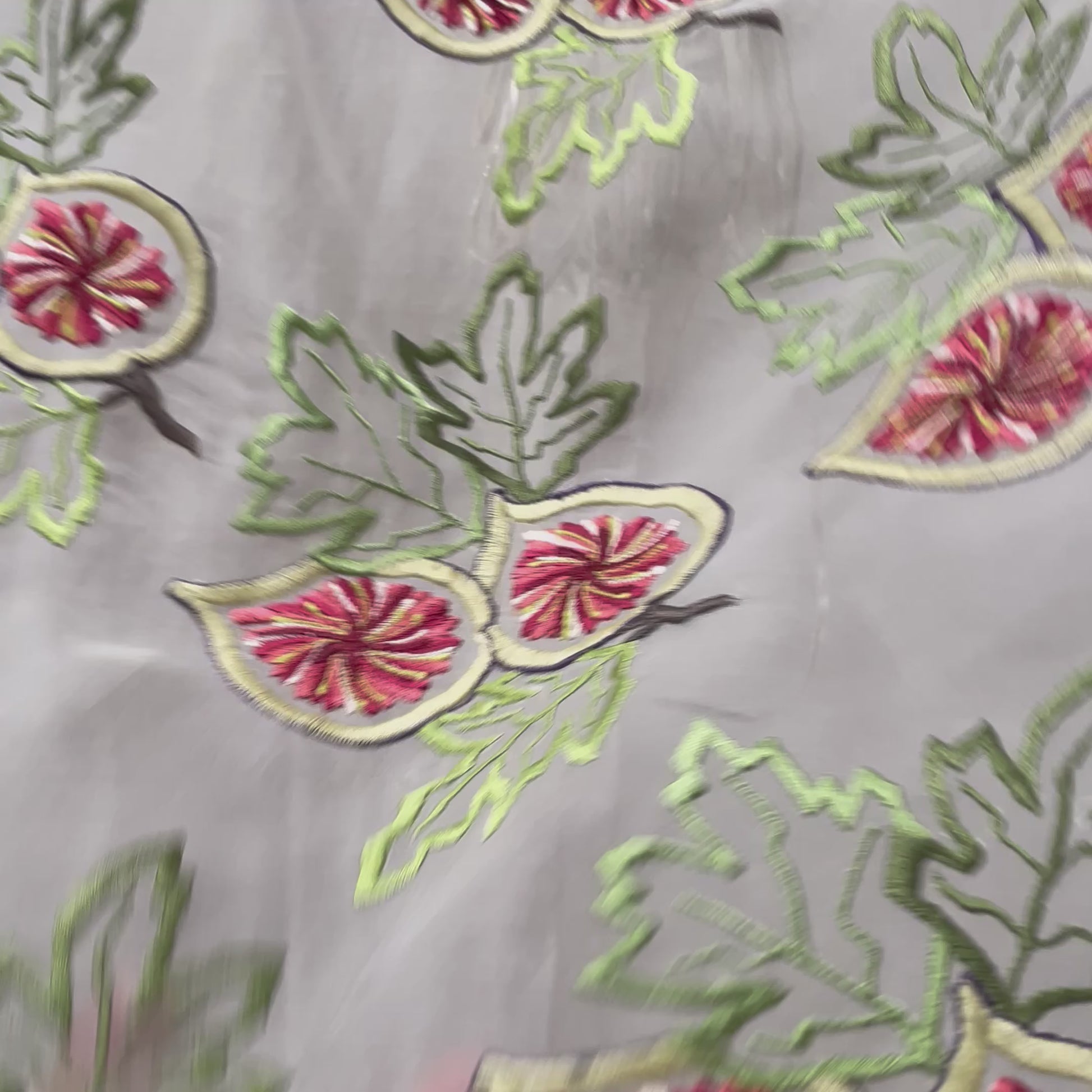 Video of sheer silk fig embroideries on a hanging piece of silk organza