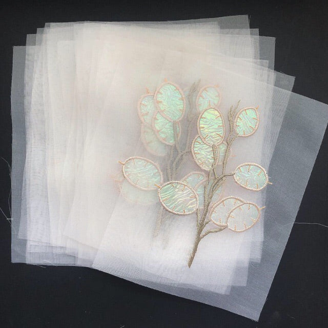 Stack of sheer silk organza honesty embroideries