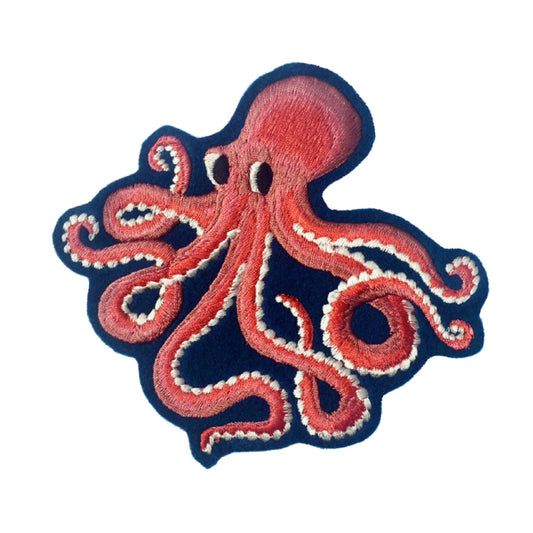 Octopus embroidered patch on white background