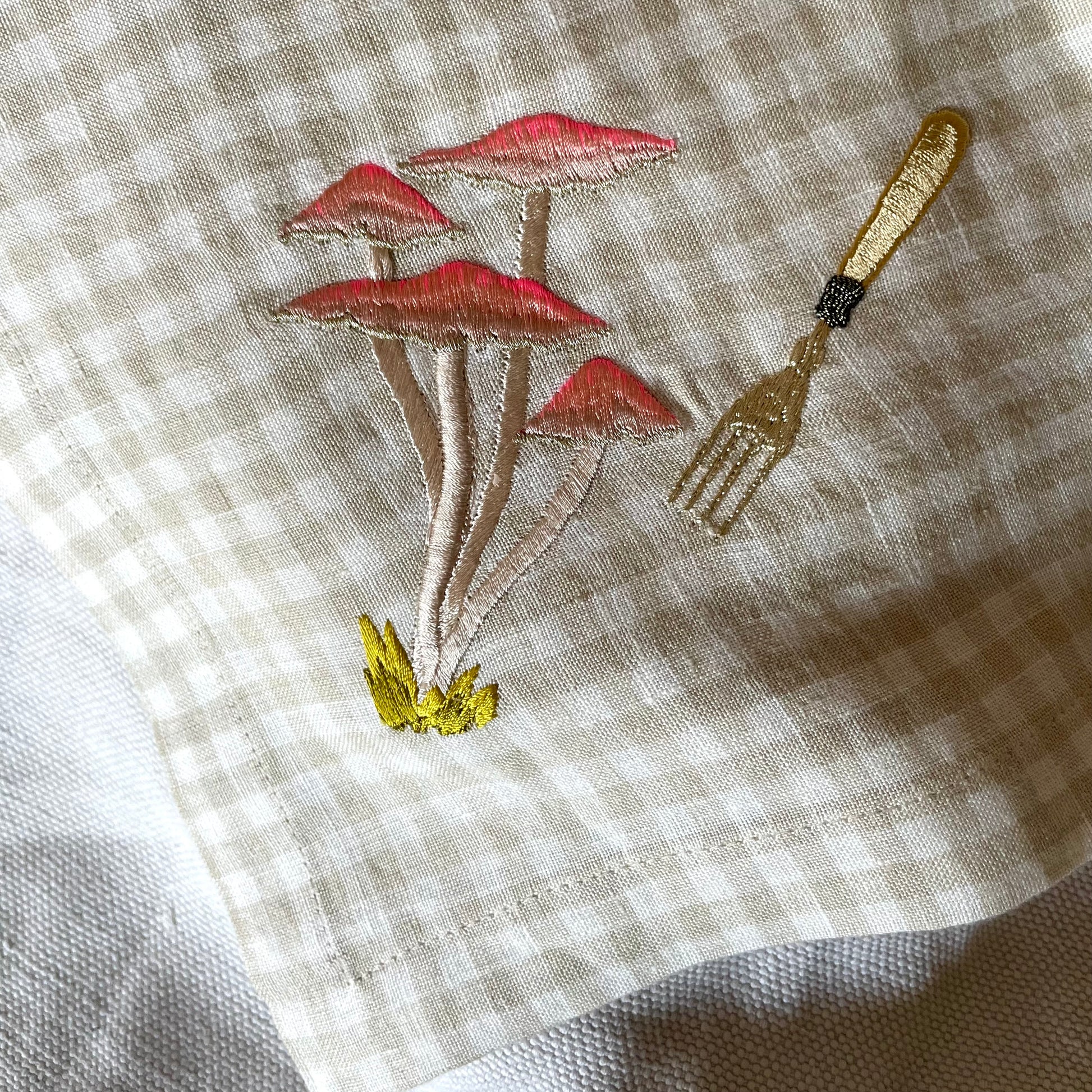 pink mushrooms on gingham napkin