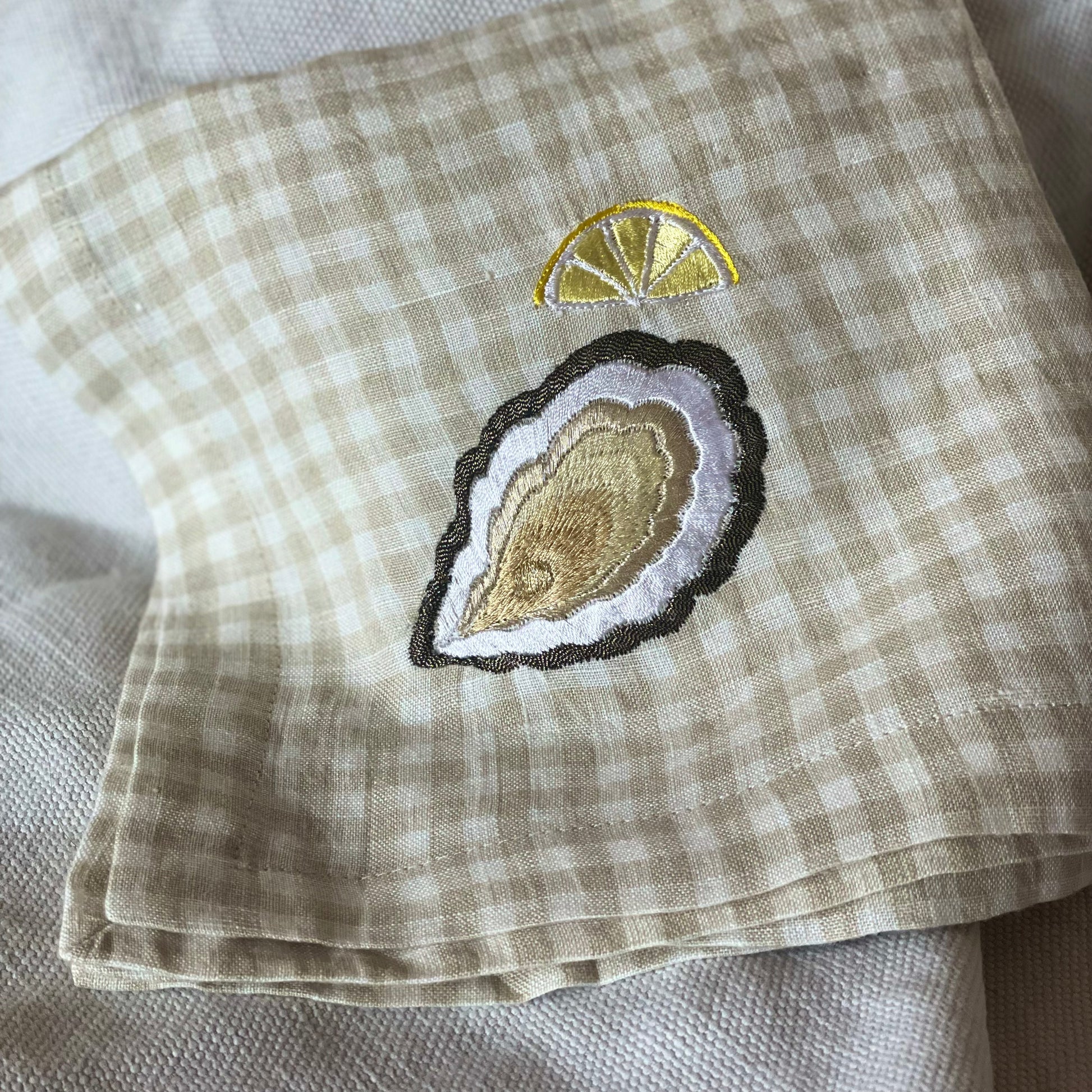 metallic embroidered oyster and lemon on gingham napkin