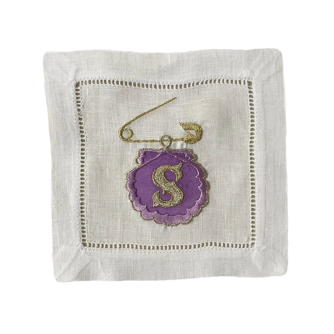 Lilac silk embroidered custom shell artwork with gold letter S, on white background