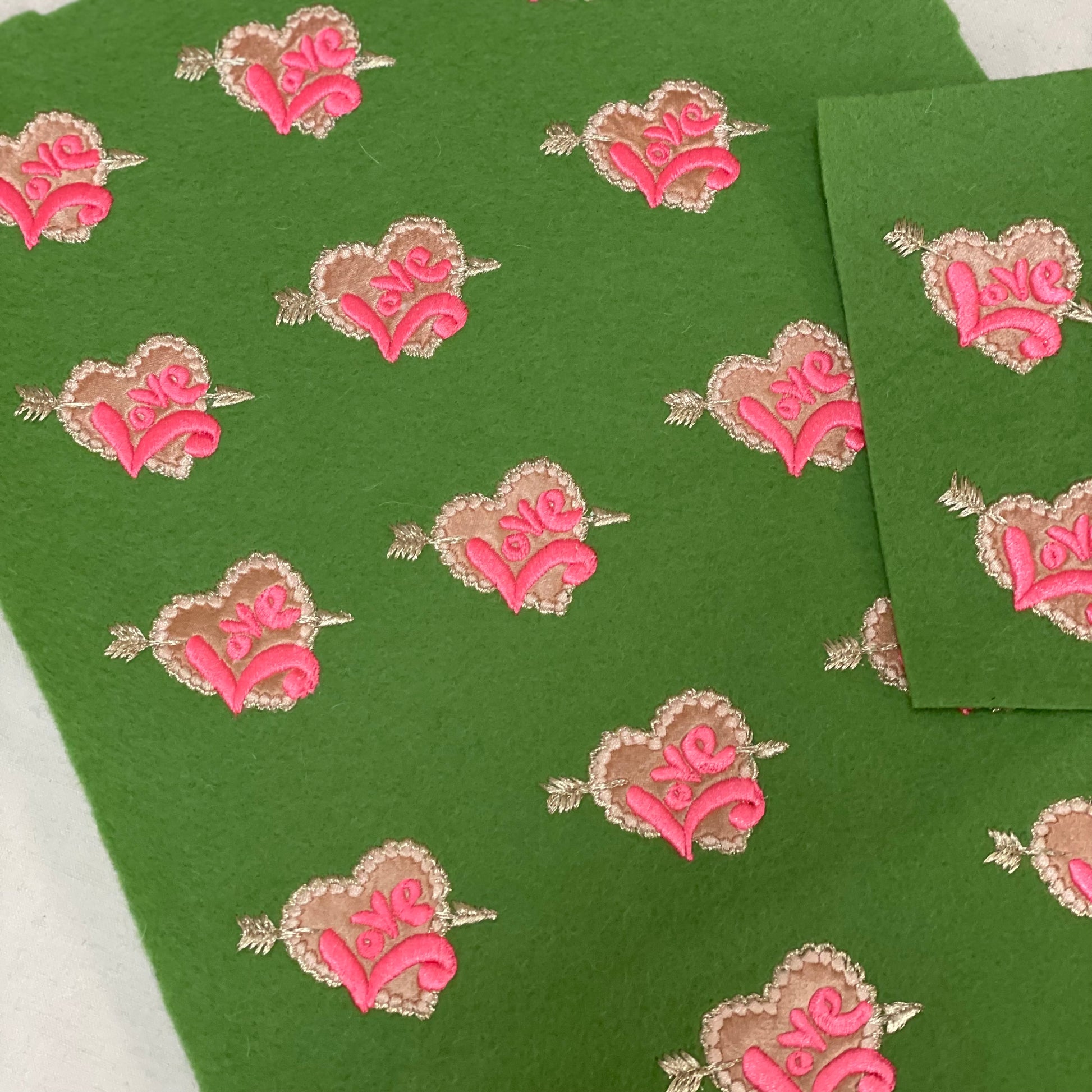 love embroideries on green felt