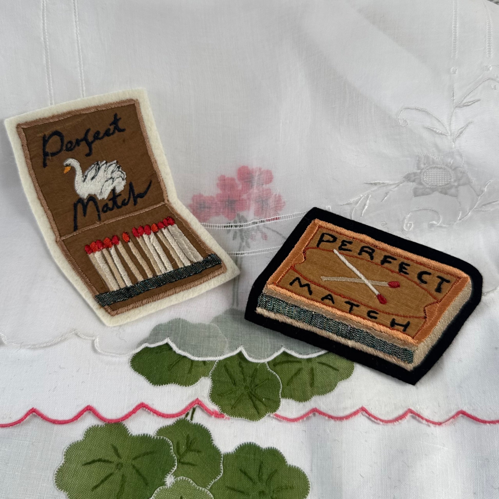embroidered matchbox and matchbook on vintage fabric