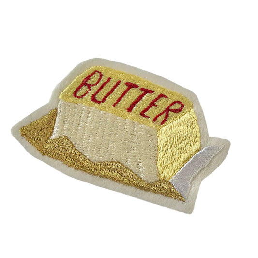 embroidered butter on white background
