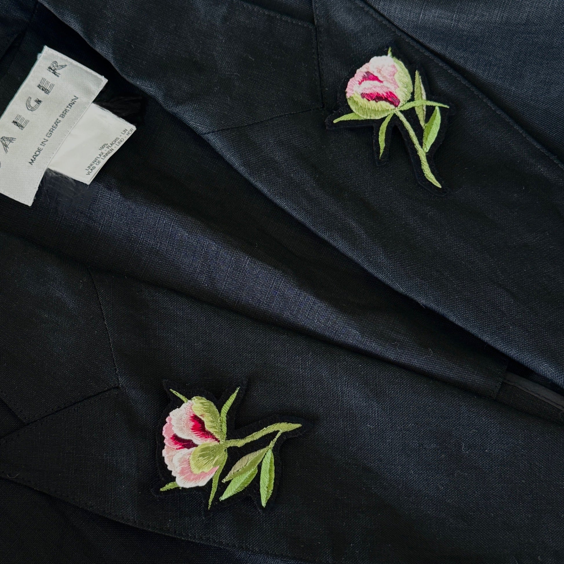 jacket, featuring two embroidered pink peony buds with green leaves on the lapels