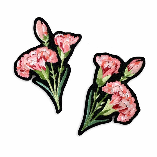 Two floral patches with pink flowers and green leaves on a white background