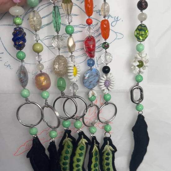 Beaded bag charms hanging up