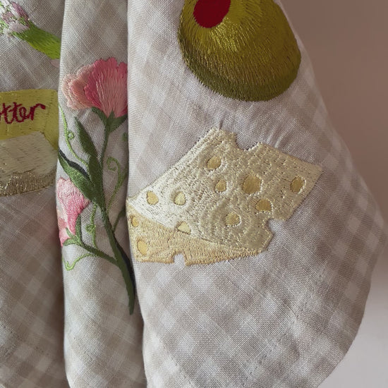 Video showing close up of the embroidery on the linen napkins