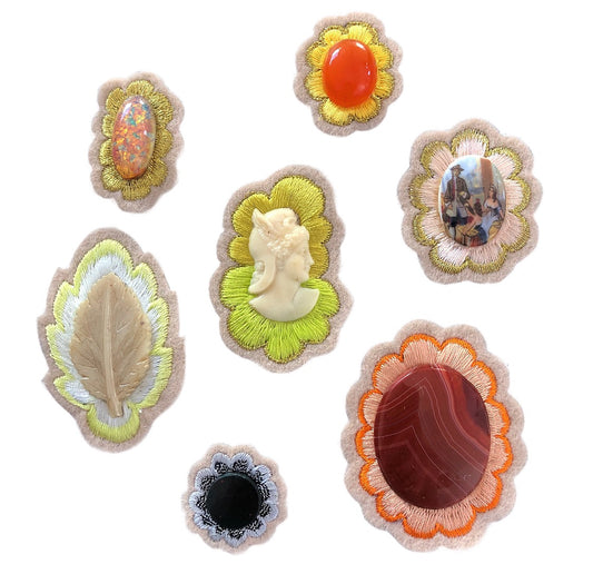 Collection of gemstone embroidered patches on white background