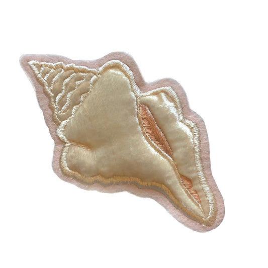 Velvet conch shell embroidered patch on white background