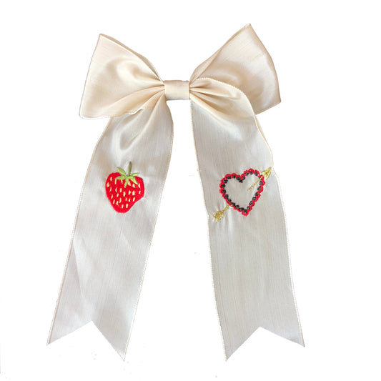 Vintage ribbon strawberry hair bow on white background