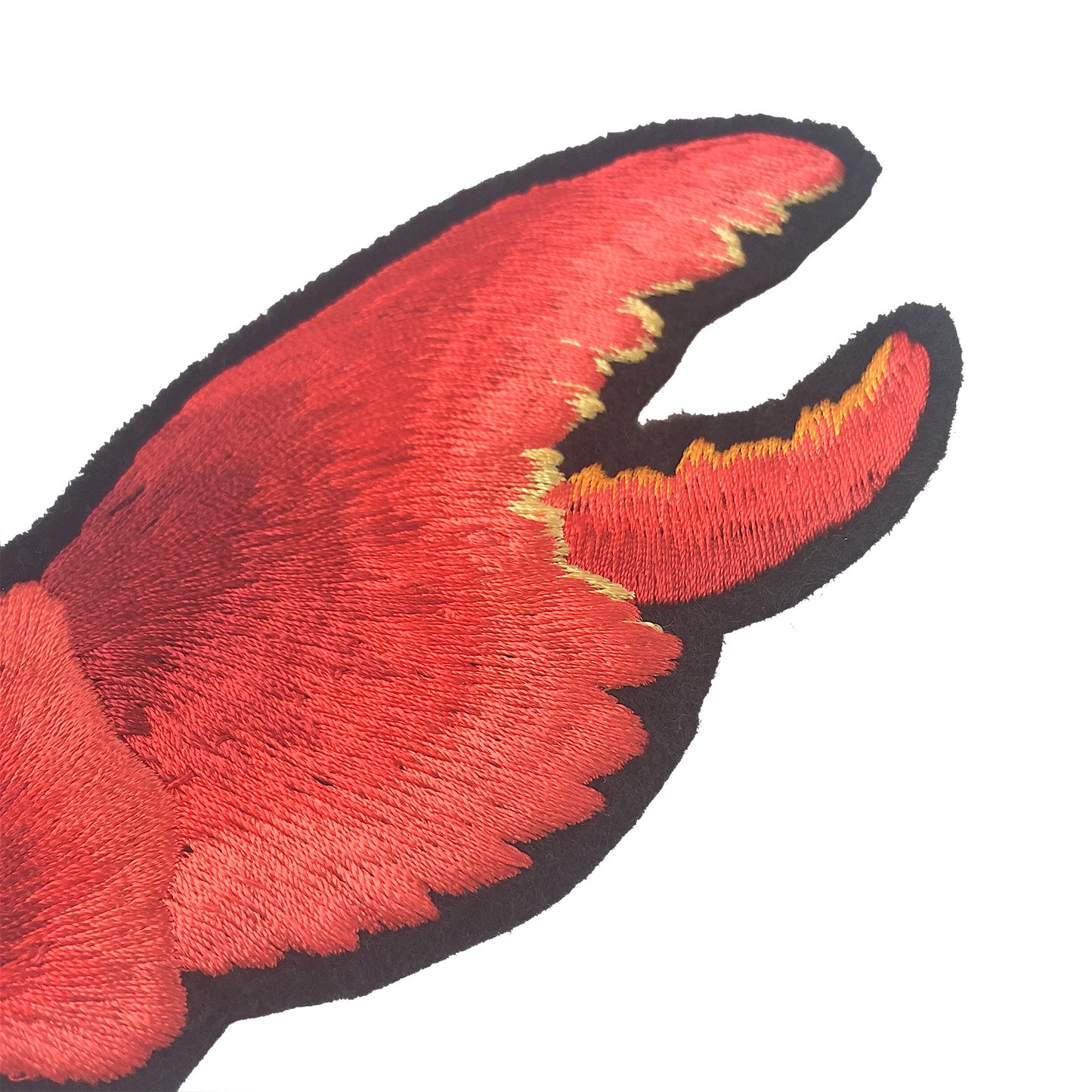 Close-up of the embroidery on the lobster claw patches