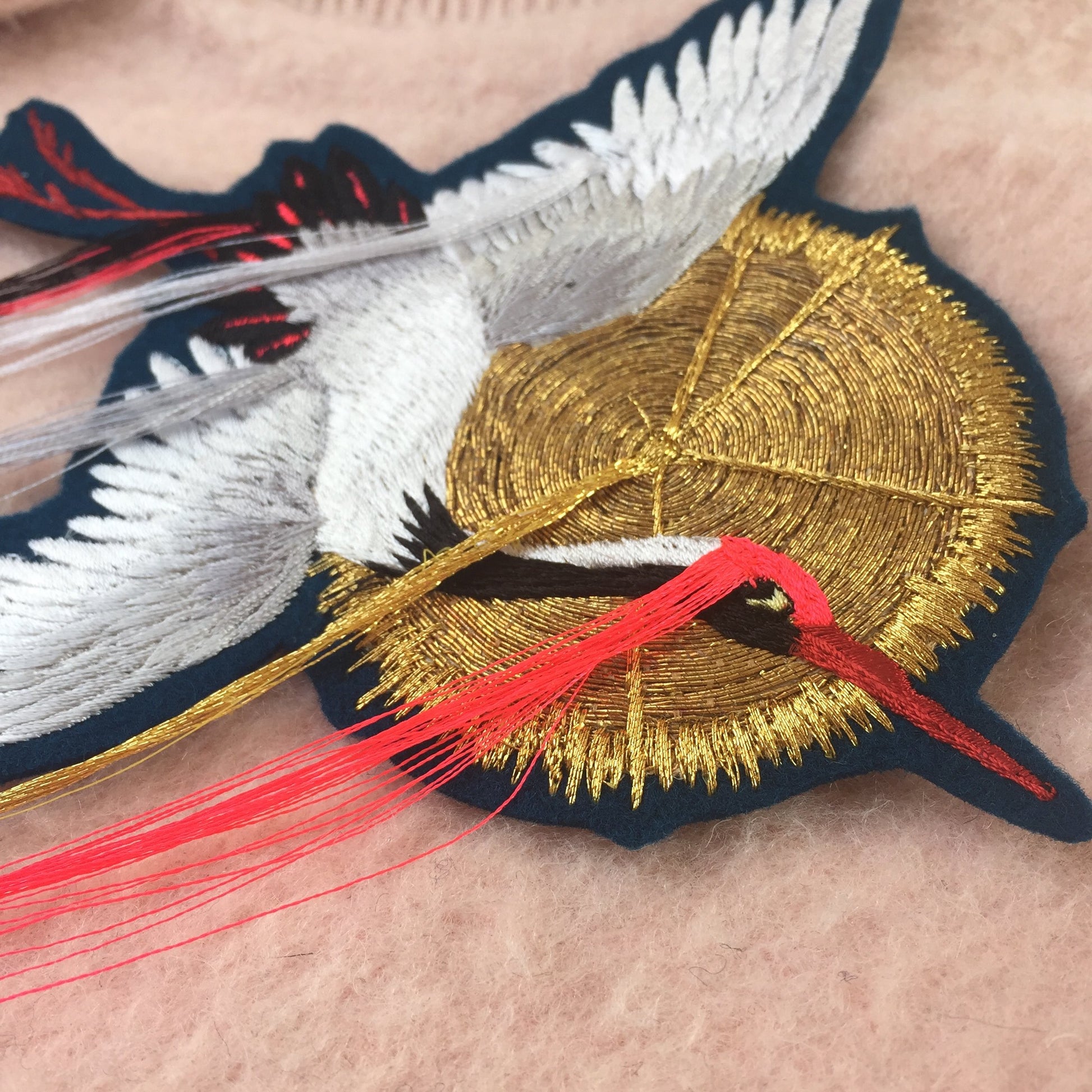 Close-up of Fringed Crane Embroidered Patch