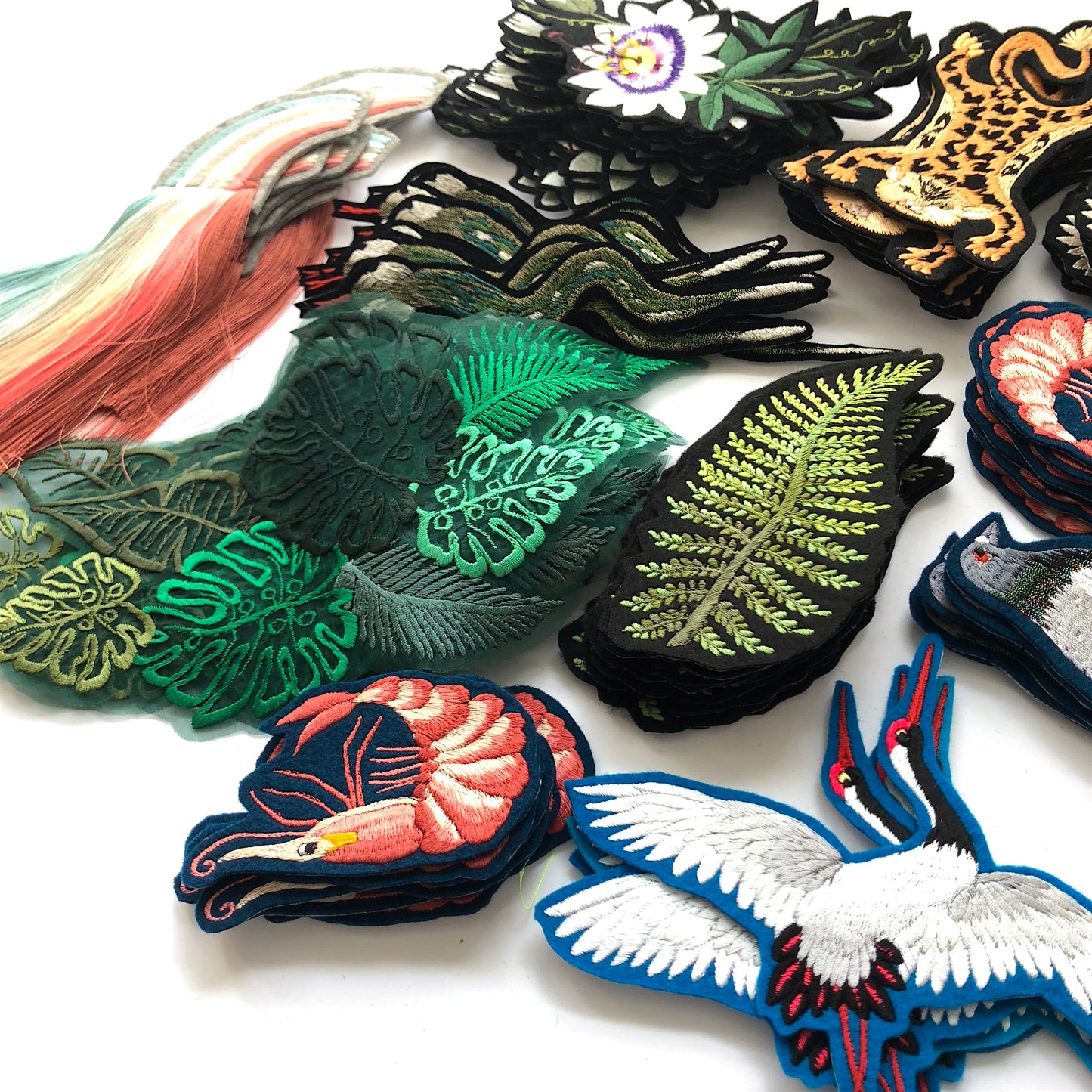 Selection of Ellie Mac embroidered patches and artworks including fern, prawn and sheer silk embroidered leaves