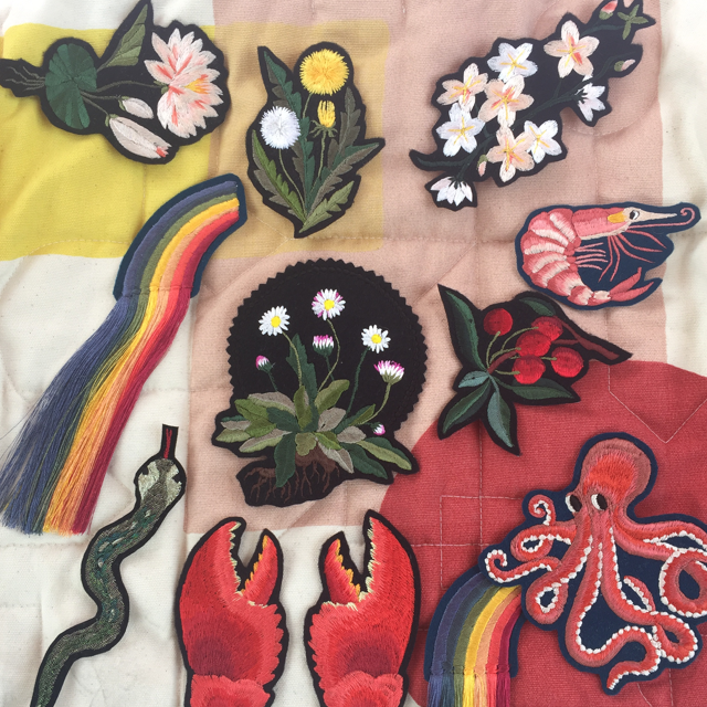 Selection of Ellie Mac embroidered patches including prawn, daisy, lobster claws and fringed rainbow