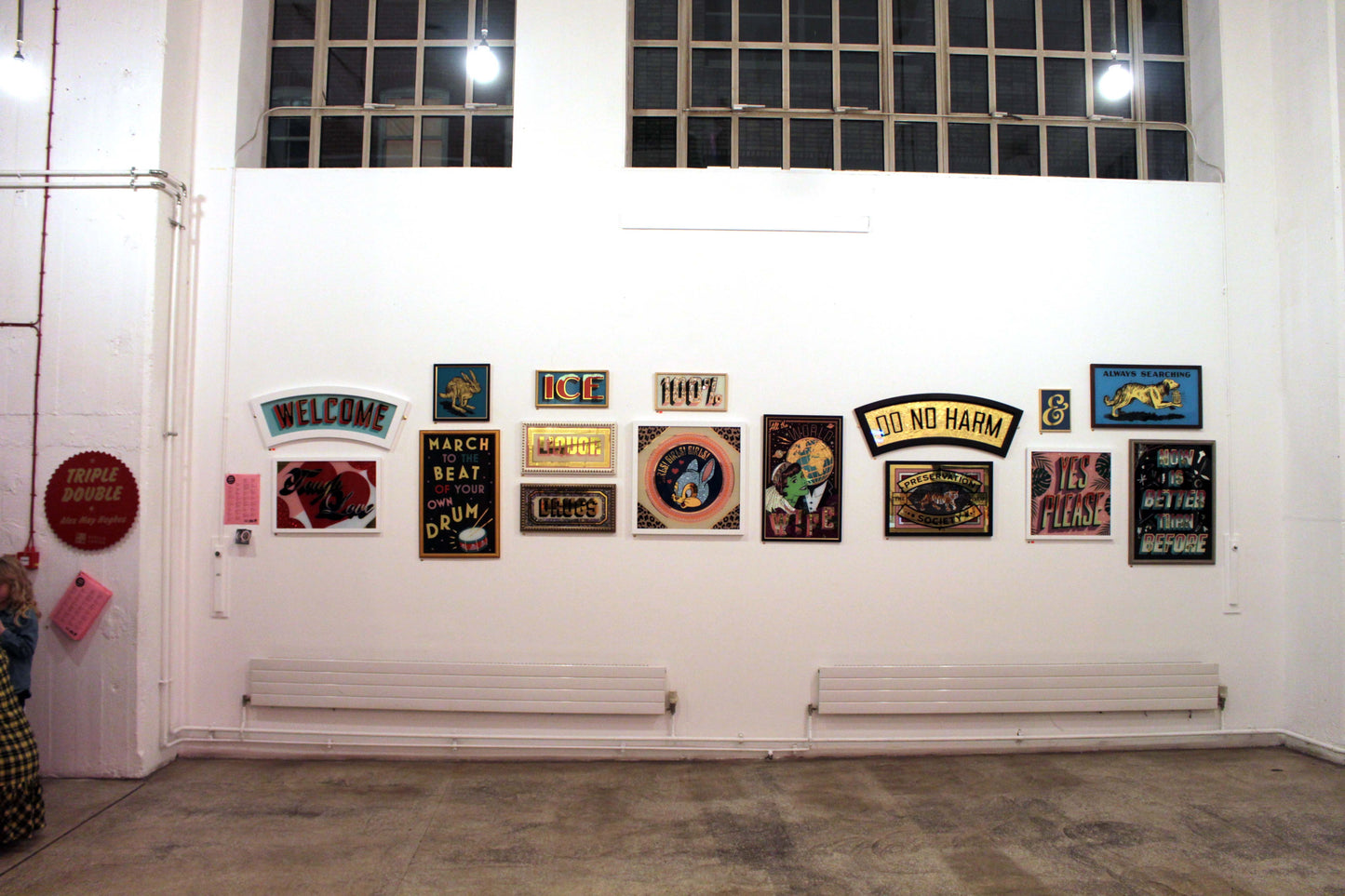 White gallery wall showing various artworks from the 3rd solo show of Alex May Hughes