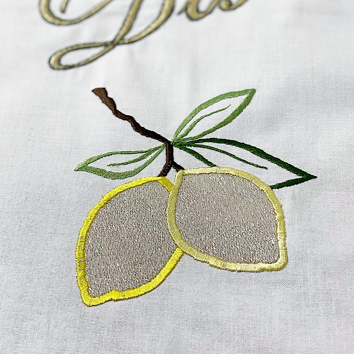 Close-up of embroidered lemons on Kitchen Disco artwork