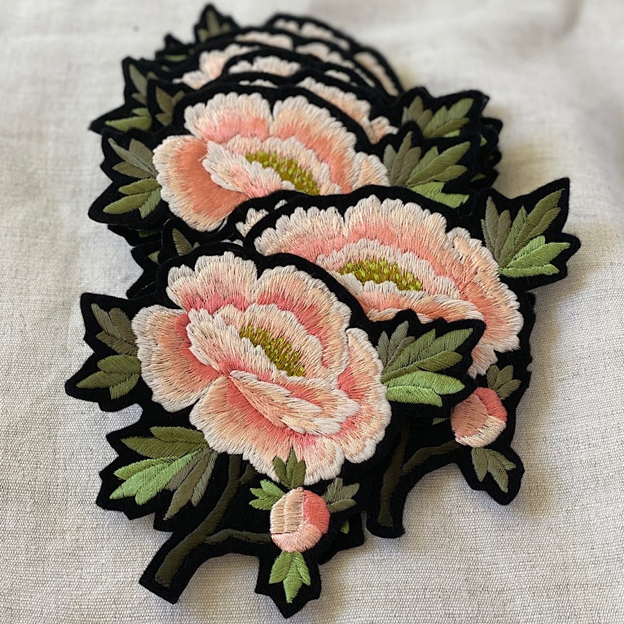 A selection of pink peony embroidered patches