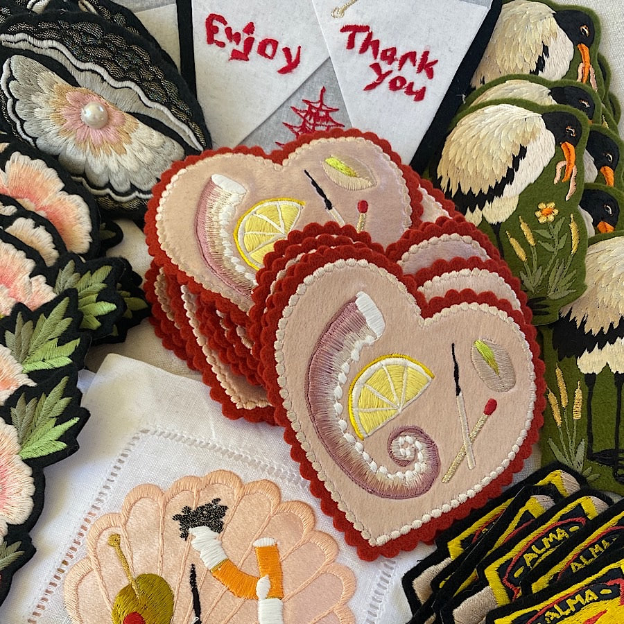 Collection of different Ellie Mac Embroidery patches with the Minature Platter Embroidery in the centre of the colletion