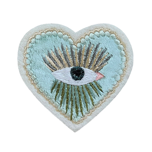 Velvet heart embroidered patch on white background
