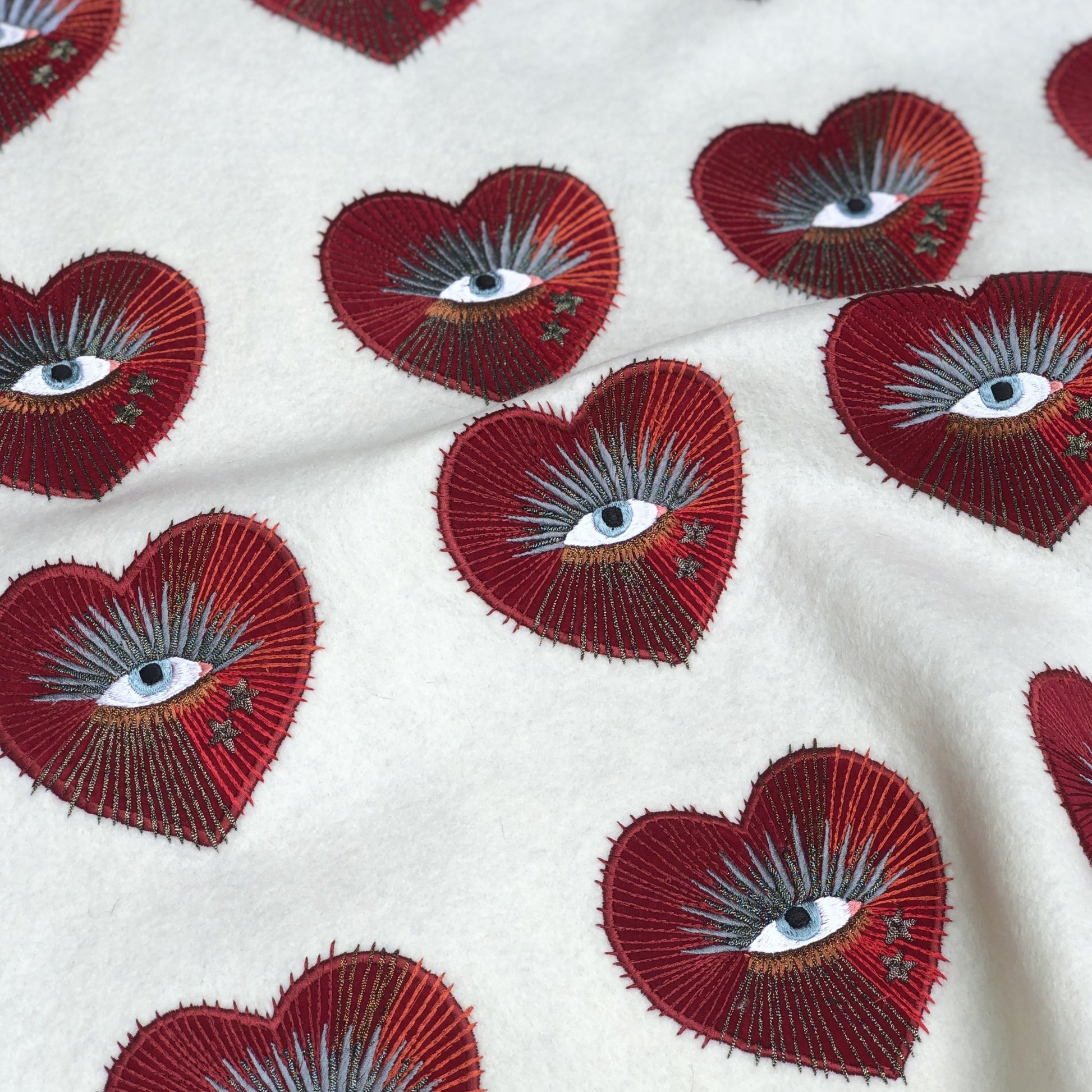 Selection of pre-cut sacred heart with eye embroidered patches