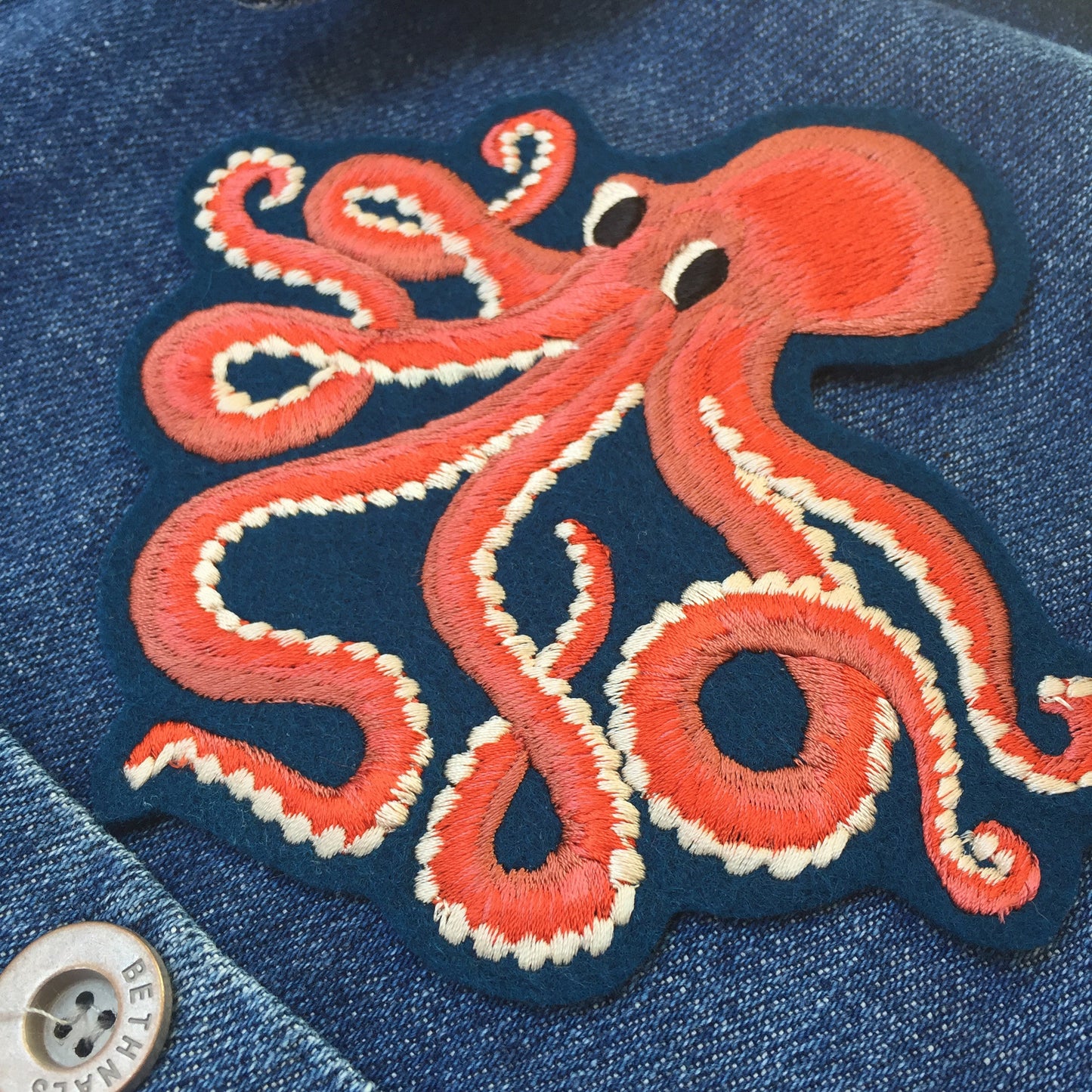 Close-up of octopus embroidered patch 