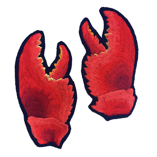 Paif of embroidered lobster claw patches on white background