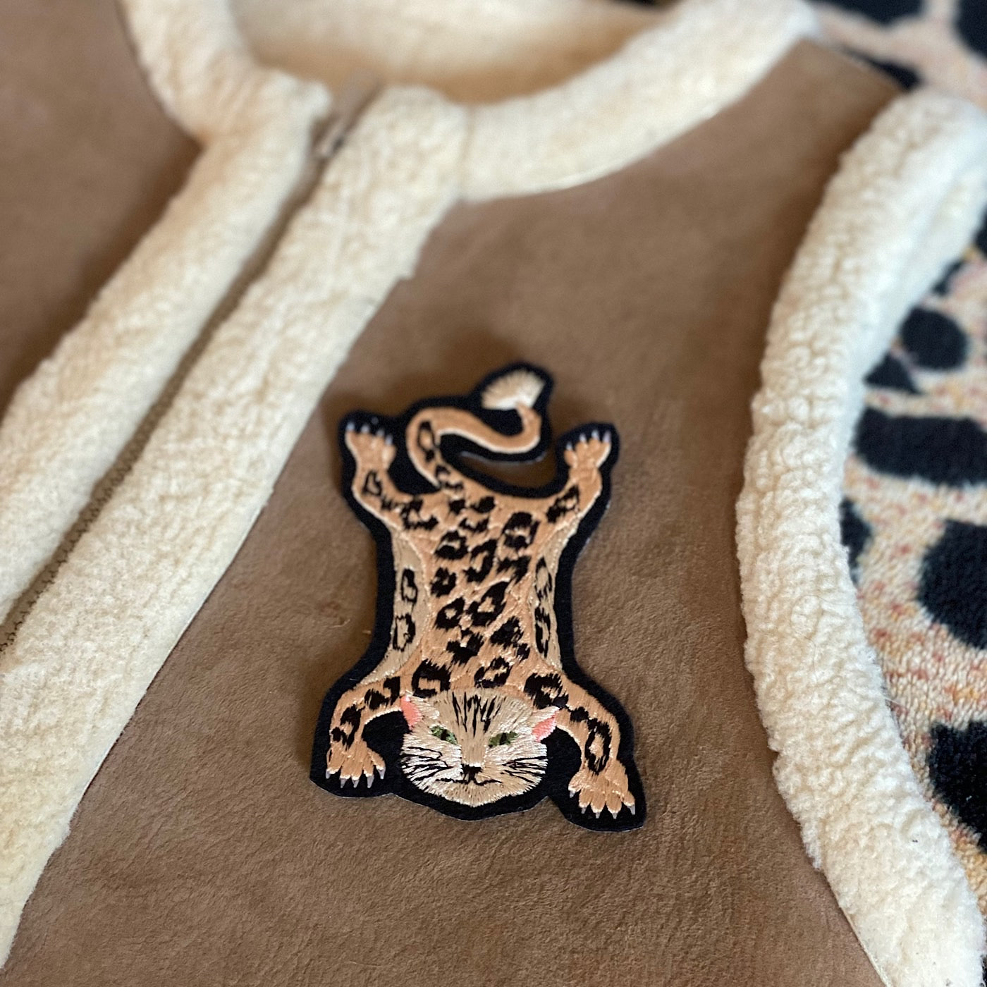 Close-up of leopard embroidered patch on item of clothing
