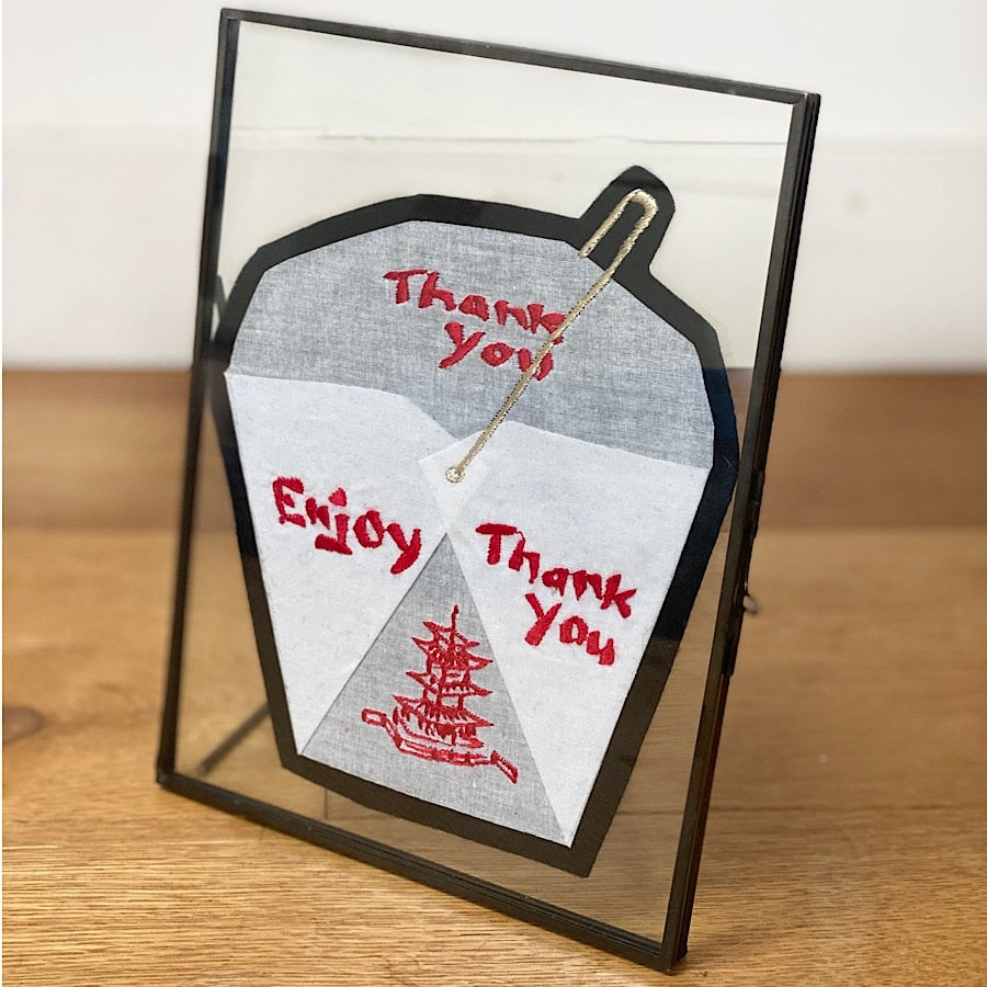 Origami takeaway box embroidered artwork in a glass picture frame