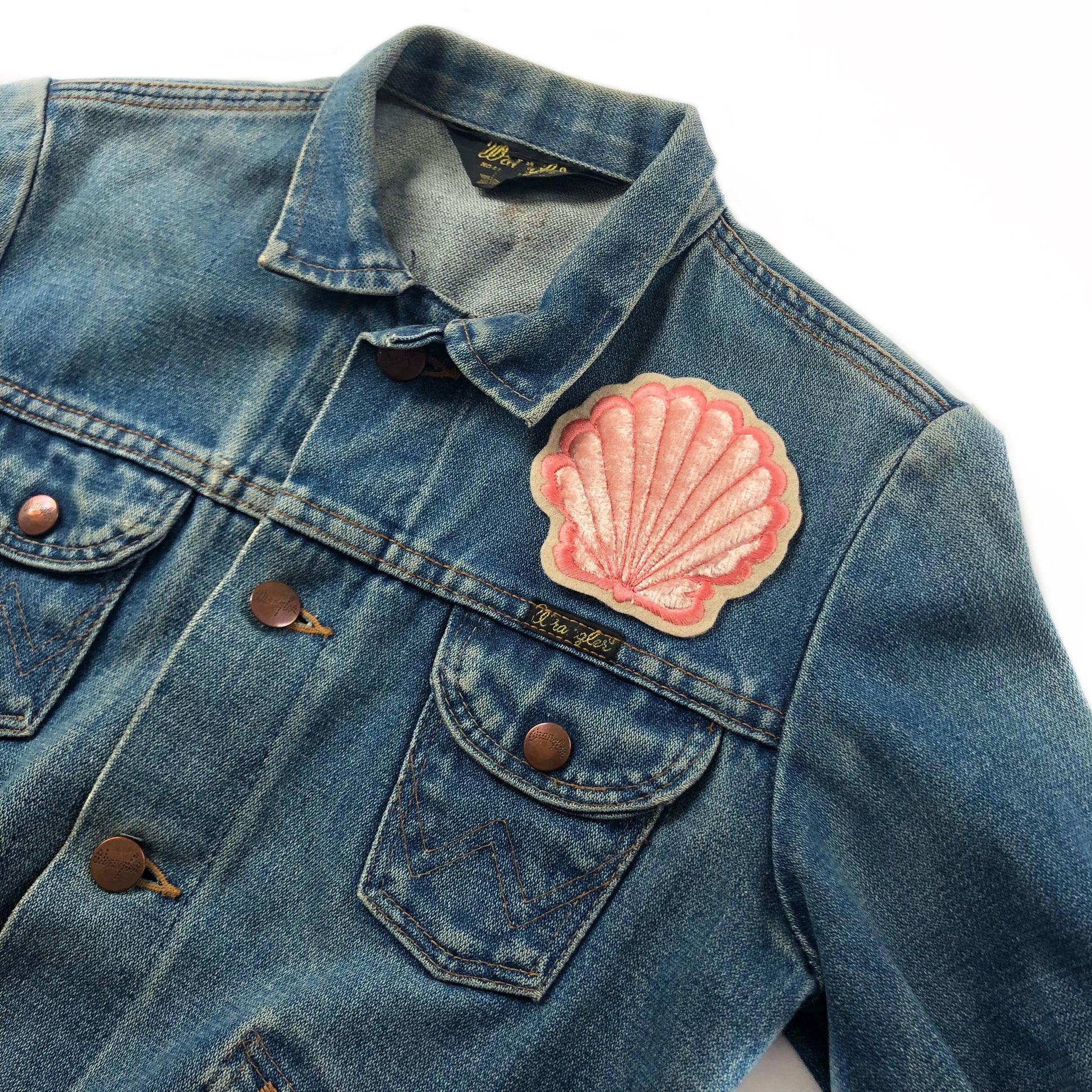 Padded velvet clam patch shown on front breast of denim jacket