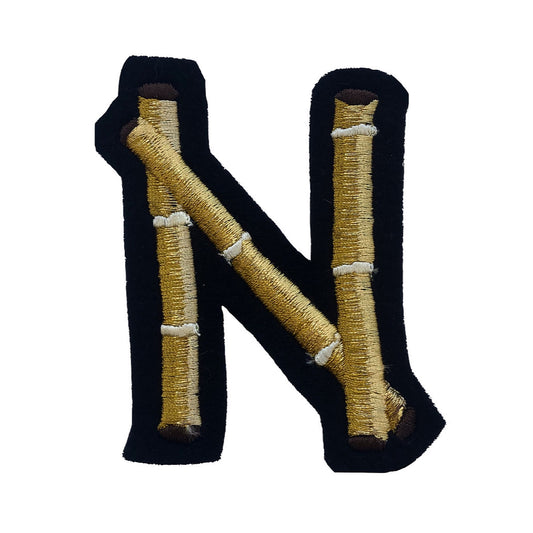 Bamboo embroidered letter N on white background