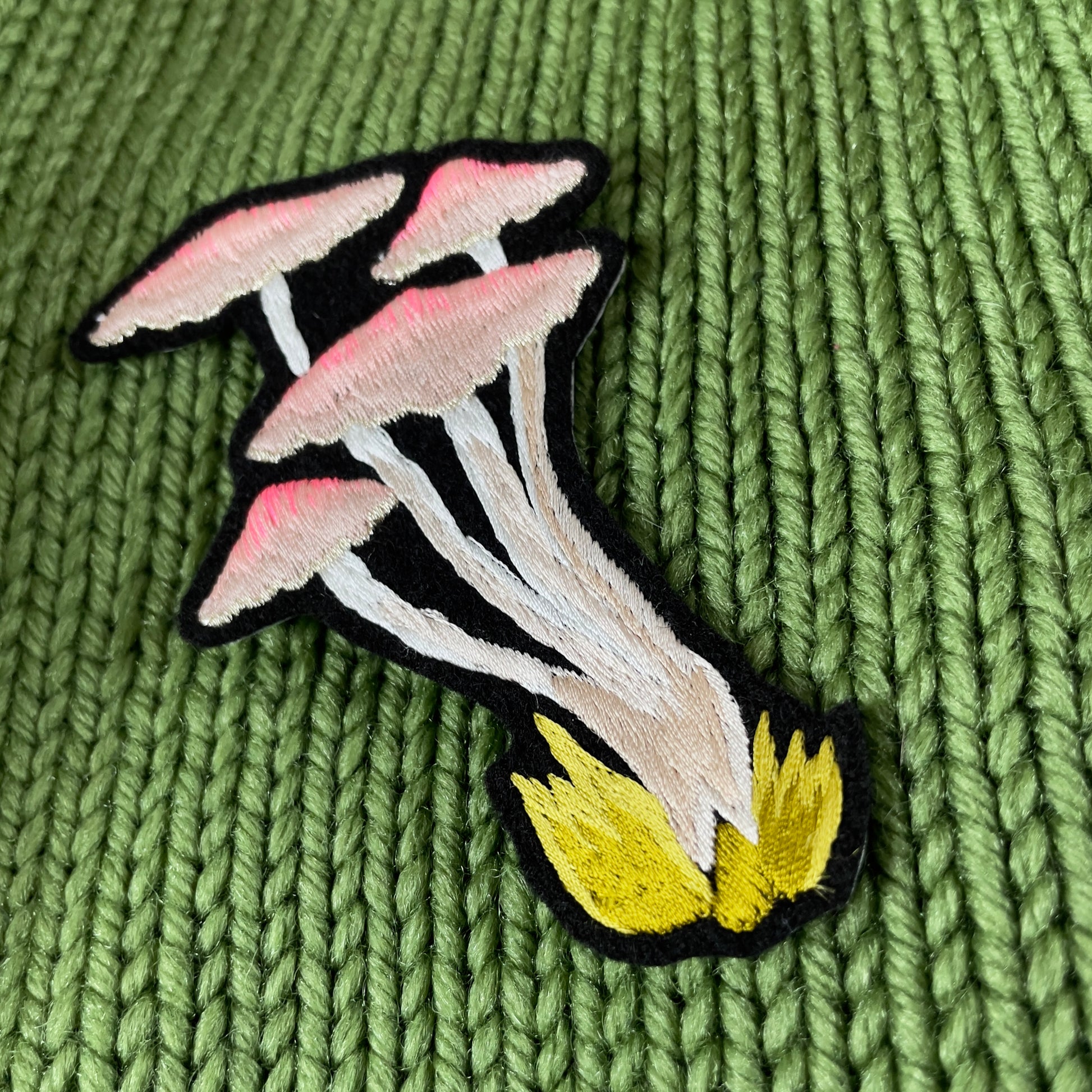 Woodland Mushroom Embroidered Patch shown on green background