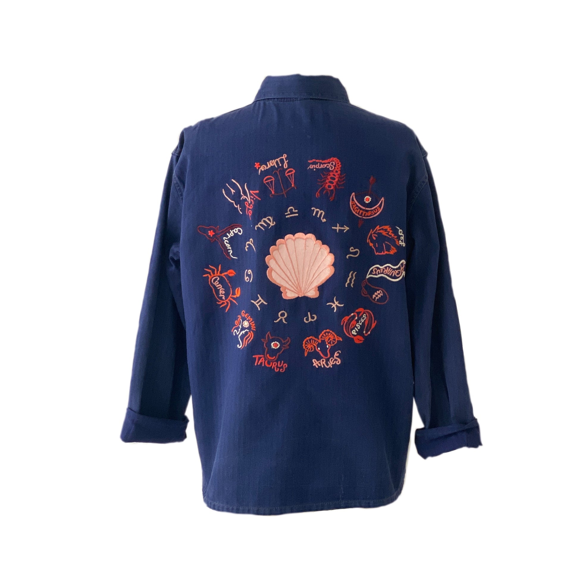 Zodiac embroidery on back of navy blue shirt