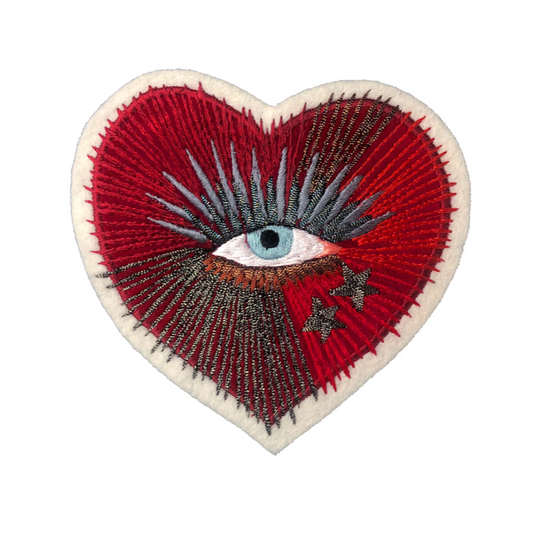 Sacred heart with eye embroidered patch on white background