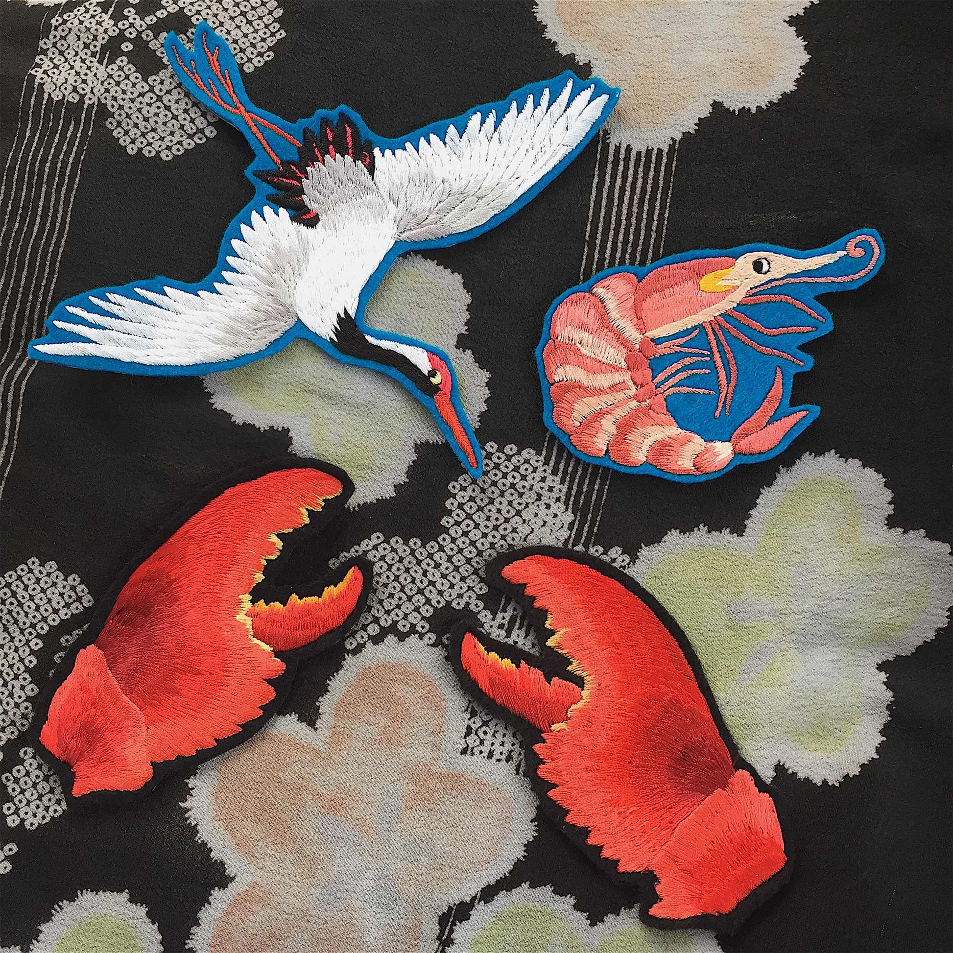 Small selection of Ellie Mac embroidered patches including a crane, prawn and a pair of lobster claws